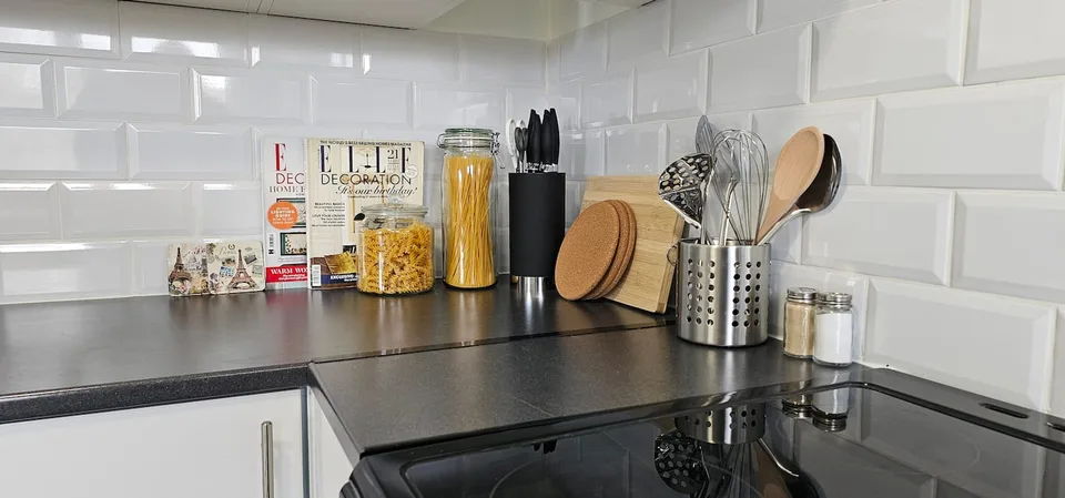 Kitchen worktop with kettle, utensils and toaster